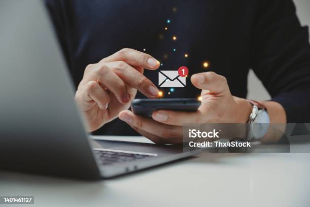 Hand Of Businessman Using Smartphone For Email With Notification Alert Stock Photo - Download Image Now