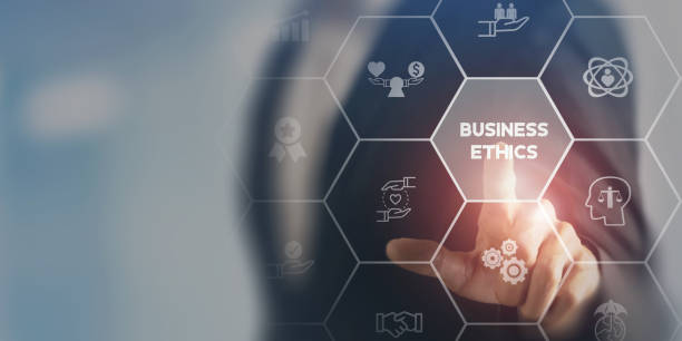 istock Business ethics concept. Ethical investment, sustianable development. Business integrity and moral. Businessman touching on BUSSINESS ETHICS wording on smart screening surrounded by ethical elements. 1401465298