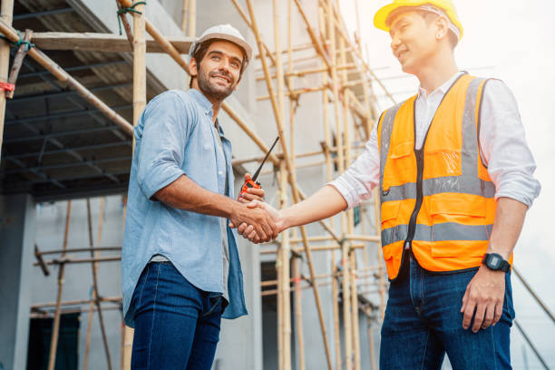 istock Portrait of Architect and engineer construction workers shaking hands. 1401466044