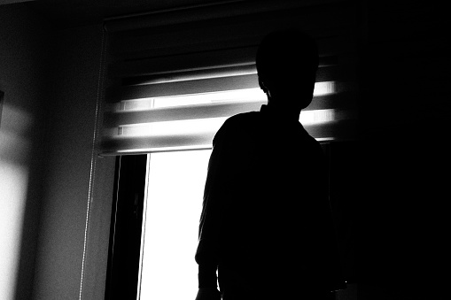 Window and silhouette of a person