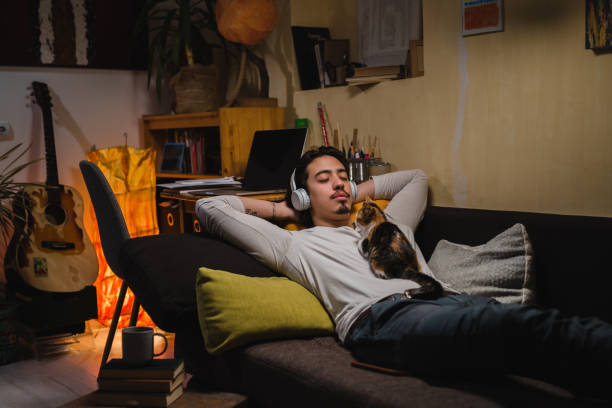 istock young caucasian man relaxing in his room 1401466914