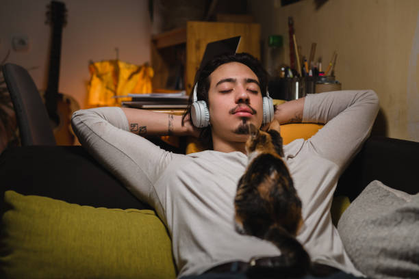 istock young caucasian man relaxing in his room 1401466931
