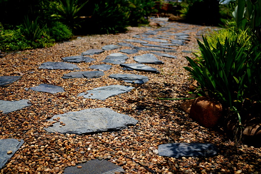 Stone footpath on small stone in garden
