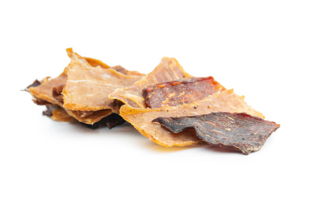 istock Turkey and beef jerky meat. Dried sliced meat isolated on white background. 1401471752