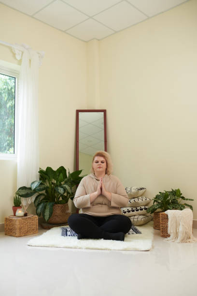 istock Relaxed Woman Meditating 1401471959