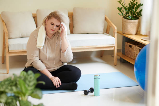 istock Tired Woman Wiping sweat 1401471960