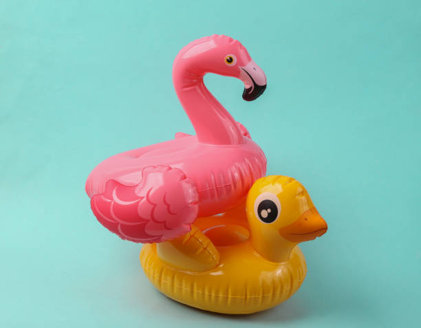 istock Inflatable duck and flamingo on a blue background. Pool party. Summer concept. Creative layout 1401472774