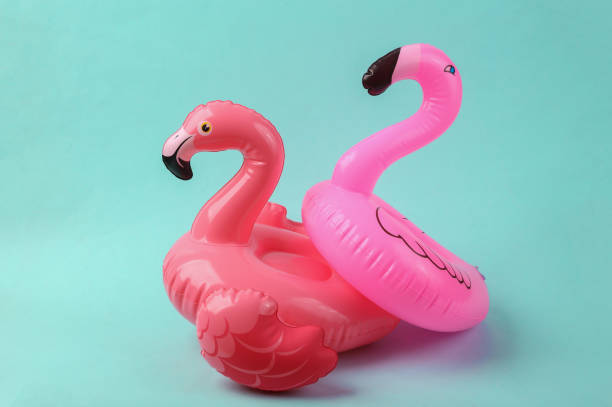 istock Inflatable two flamingo on blue background. Pool party. Summer concept. Creative layout 1401472775