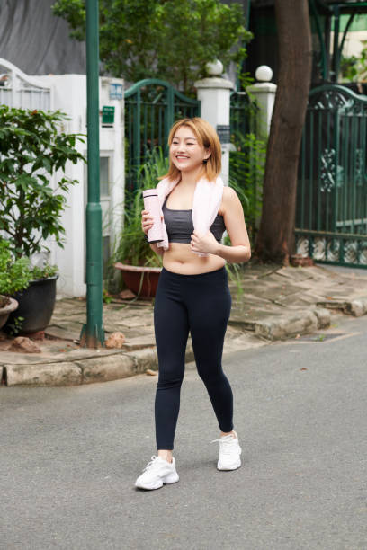 istock Woman Walking Home after Jog 1401473044
