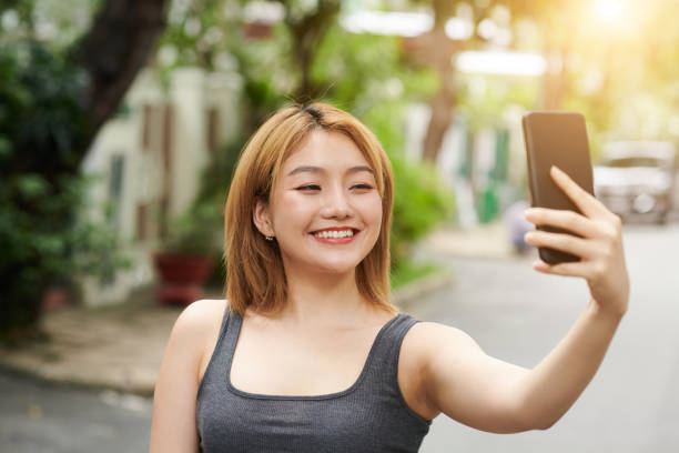 istock Woman Taking Selfie Outdoors 1401473084