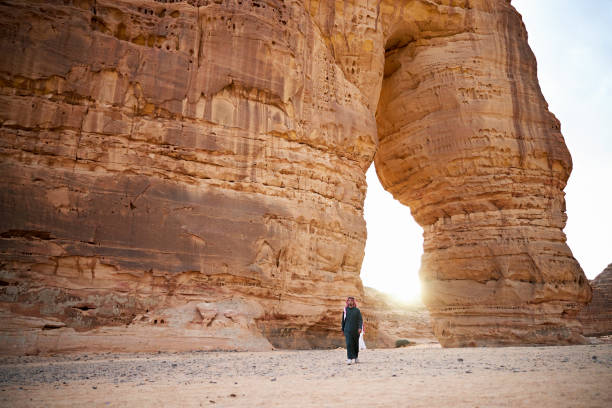 istock Young Saudi man walking away from Elephant Rock in Al-Ula 1401473289