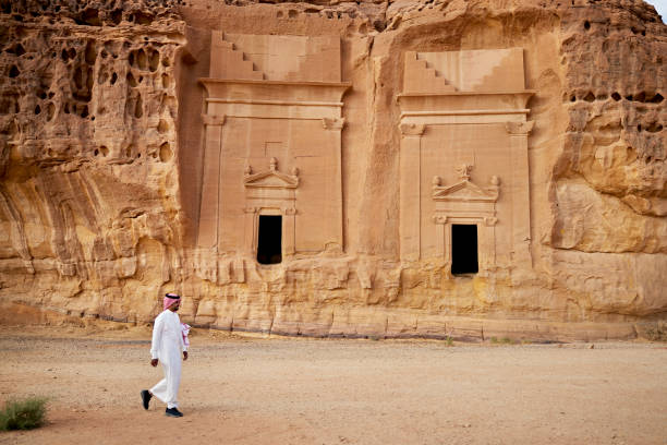 istock Young man visiting Hegra in northwestern Saudi Arabia 1401473300