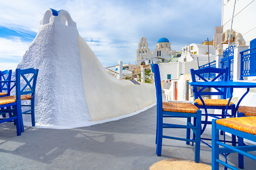Santorini island, Greece. Traditional and famous houses and churches with blue domes over the Caldera, Aegean sea