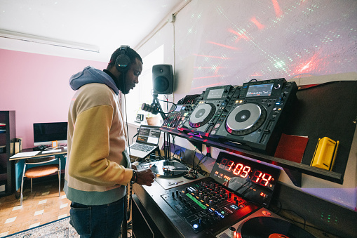 African artist, making a live music set for his listeners.