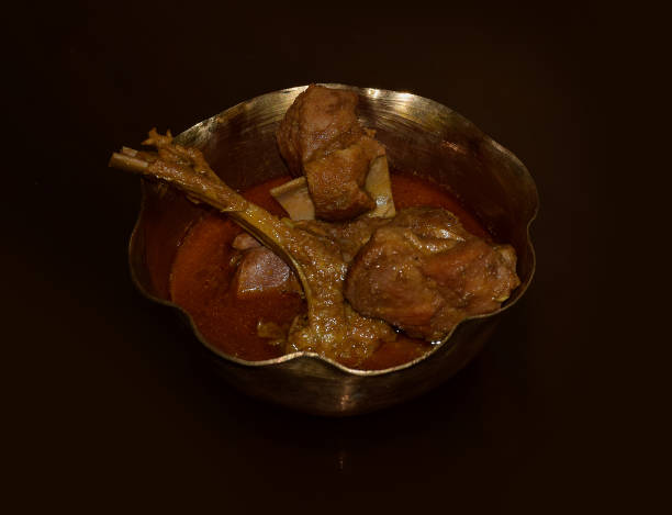 istock Indian Mutton Curry served on a brass bowl 1401475969