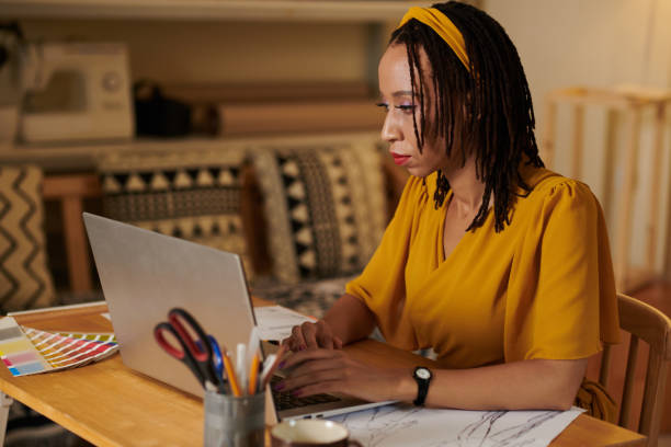 istock Fashion Student Working on Laptop 1401476369