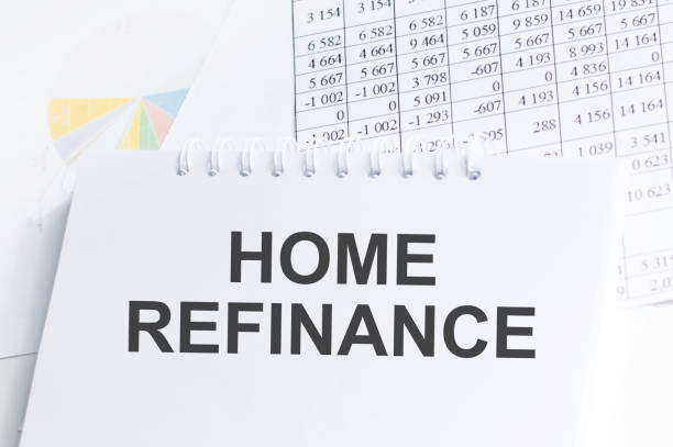 istock HOME REFINANCE text on a paper sheet with chart,color paper and calculator 1401476449