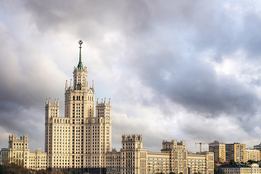 One of the old stalinist skyscraper at Moscow under overcast sunset sky