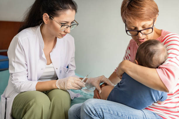 istock Baby getting vaccine shot at home 1401478460