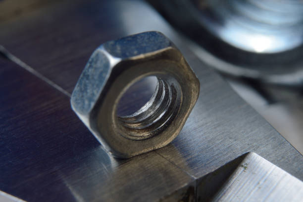 istock Accurate measuring tool caliper and metal ruler lie in place with nuts. close-up 1401478647
