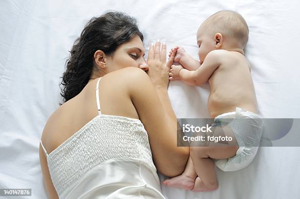 Baby Sleeping Close To Her Mother Stock Photo - Download Image Now - 6-11 Months, Affectionate, Baby - Human Age