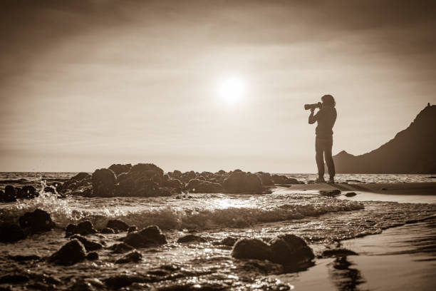 istock Woman with camera on Monsul beach, Spain 1401480744