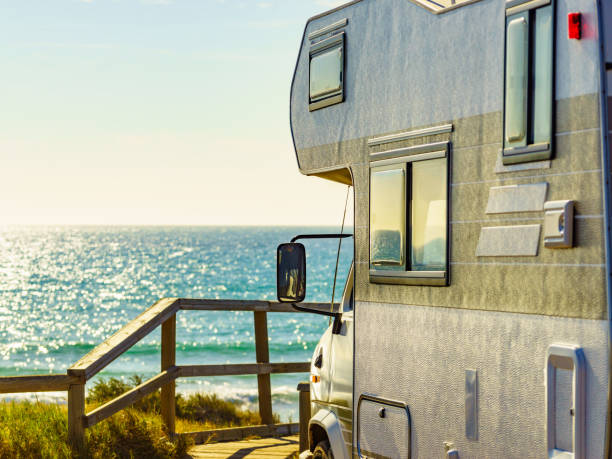 istock Camper rv camping on sea shore, Spain 1401481268