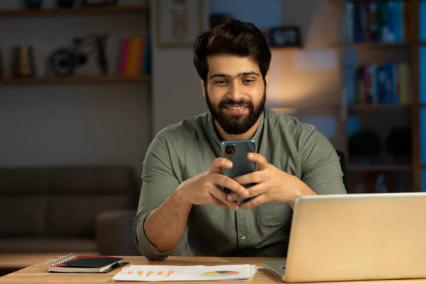 istock Handsome young man in working on laptop stock photo 1401481821