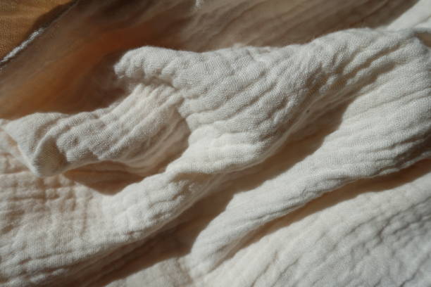 istock Crumpled simple thin white cotton muslin fabric 1401483798
