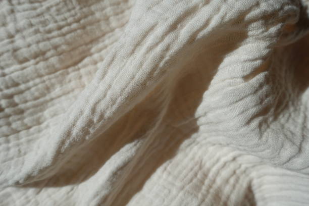 istock Soft folds on simple thin white cotton muslin fabric 1401483984