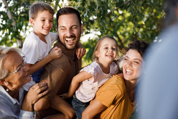 istock Cheerful extended family having fun in nature. 1401484047
