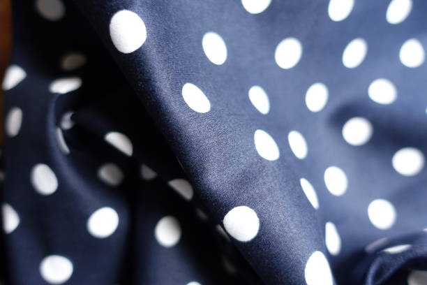 istock Soft fold on dark blue and white cotton fabric with polka dot pattern 1401484289