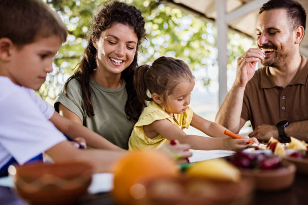 istock Happy family enjoying while coloring at the patio. 1401484514