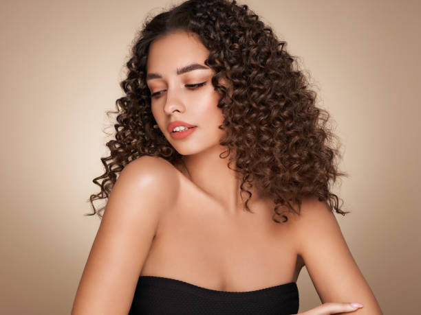 istock Beautiful smiling woman with afro curls 1401484917