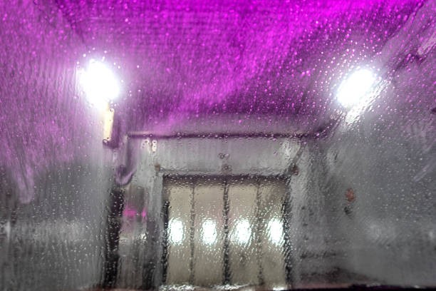 istock Indoor car wash with the view from the Driver seat. 1401485576
