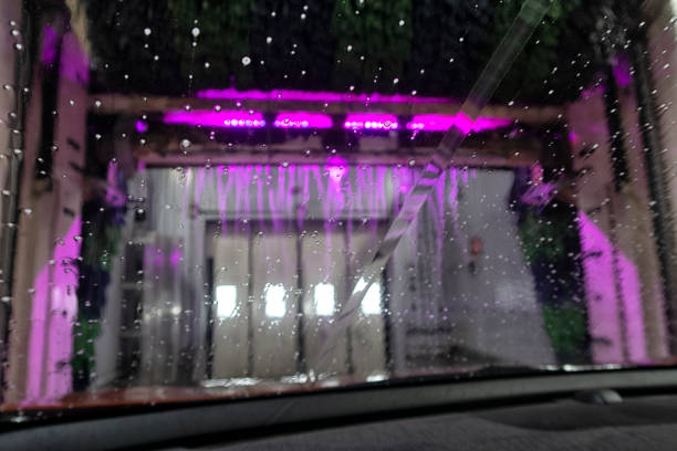 istock Indoor car wash with the view from the Driver seat. 1401485603