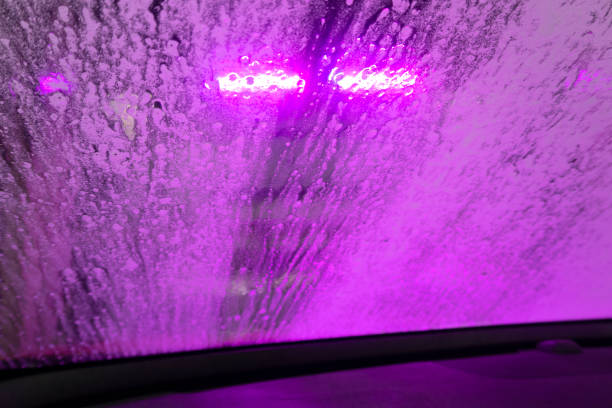 istock Indoor car wash with the view from the Driver seat. 1401485800