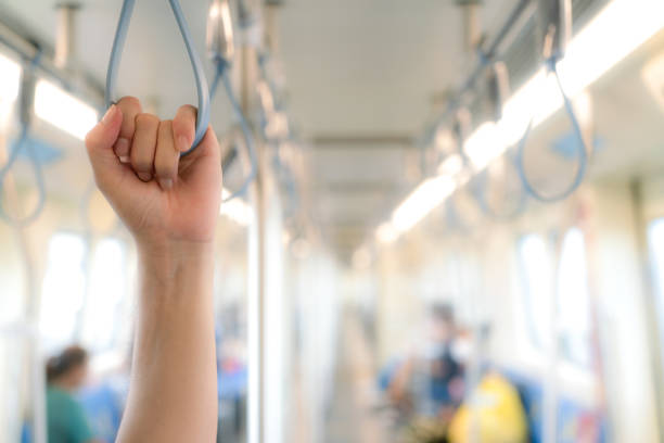 istock Hand holding a handle on the electric train for public transportation in Bangkok 1401485856
