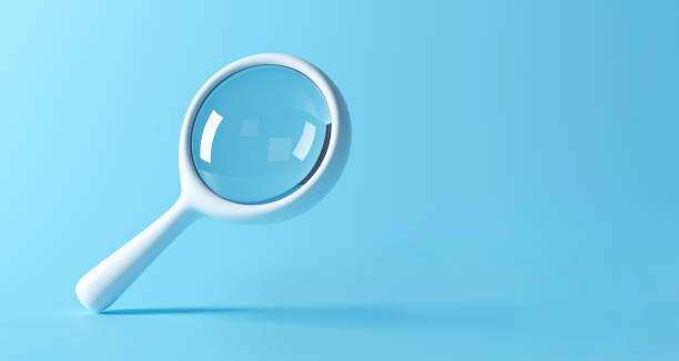 Magnifying glass on blue background. Two clipping paths included. 3D render. stock photo