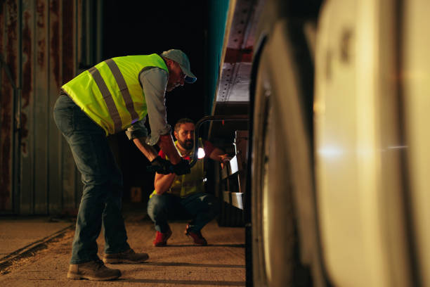 istock Truck driver men checking truck before trip 1401493862