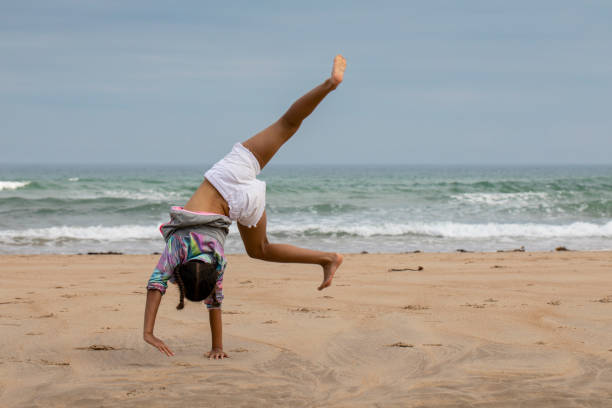 Young Lady jumps in front of an amazing scenery.