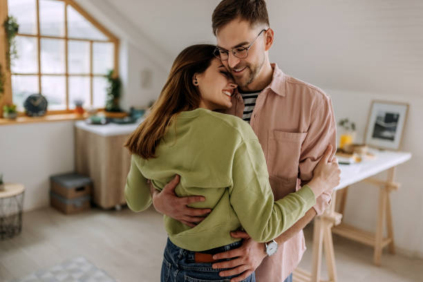 istock Lovely affectionate couple sharing a romantic moment in their apartment 1401496861