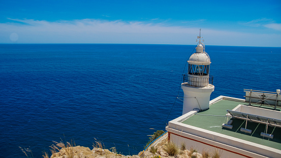 Lighthouse of the coast of Albir or L'Albir in the natural park of Serra Gelada in the bay of Altea in front of the Peñon de Ifach