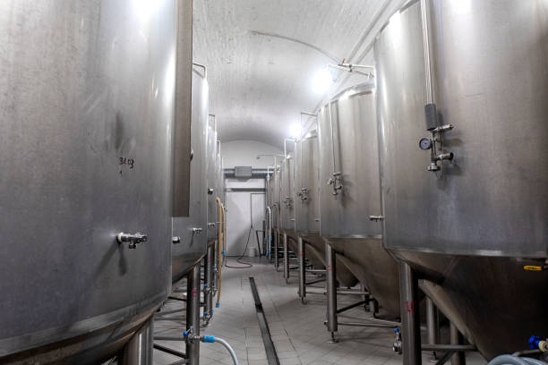istock Craft brewery tanks and pipes with manometers in private microbrewery. 1401498275