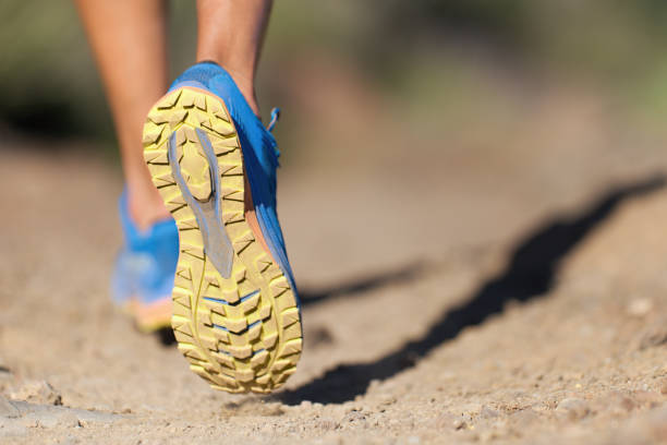 istock Athlete running sport feet on trail, selective focus on sole 1401501427