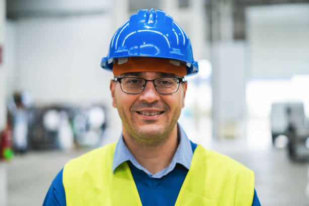 istock Happy engineer working inside robotic factory - Industrial and technology concept - Main focus on nose 1401502656