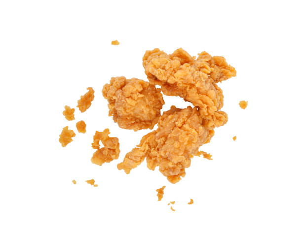 Fried popcorn chicken with crumbs isolated on white background. Top view