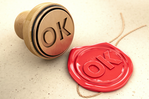 OK Stamp with Red Wax Seal. 3D Render