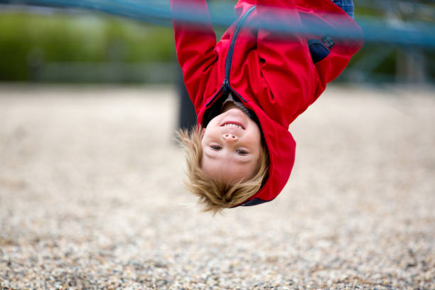 istock Cute toddler boy, playing on the playground 1401506976