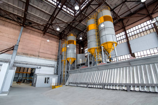 istock plant for production and mix concrete with containers for cement and sand for automatic mixing of mixture, warehouse hangar with tank for bulk plant for production of concrete products, nobody. 1401507118